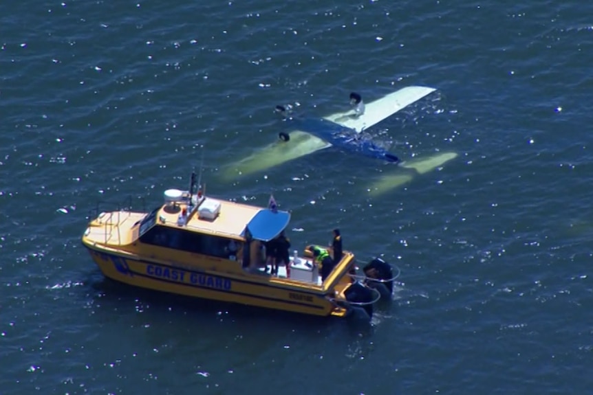 The plane upside down in the water near Redcliffe.