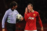 Manchester United defender Phil Jones arguing with referee