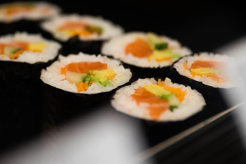 Raw salmon sushi in a shop