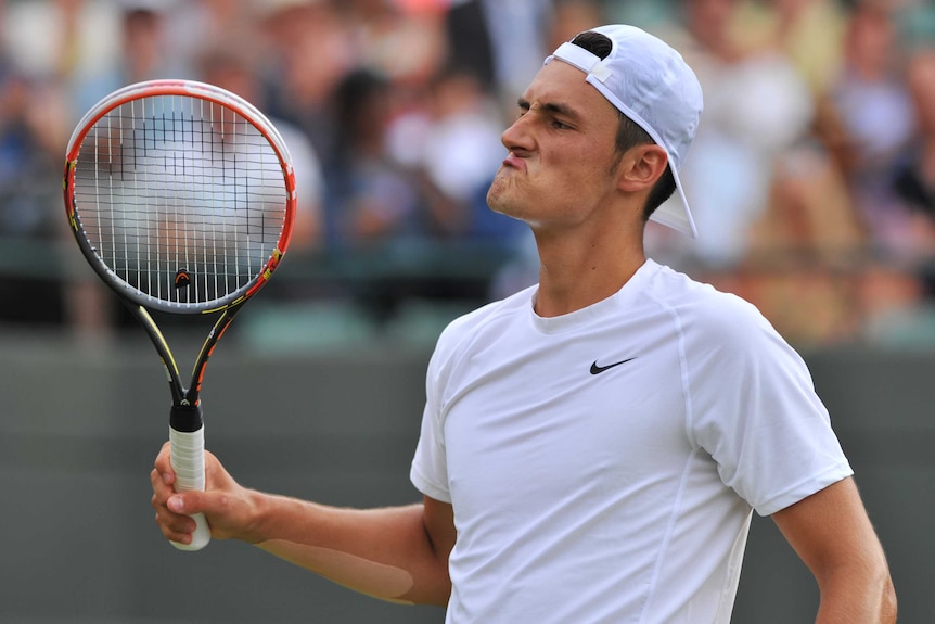 Tomic reacts in Wimbledon loss to Berdych