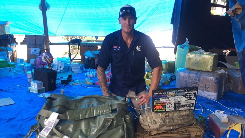 Andrew Strunk with aid supplies in Palu