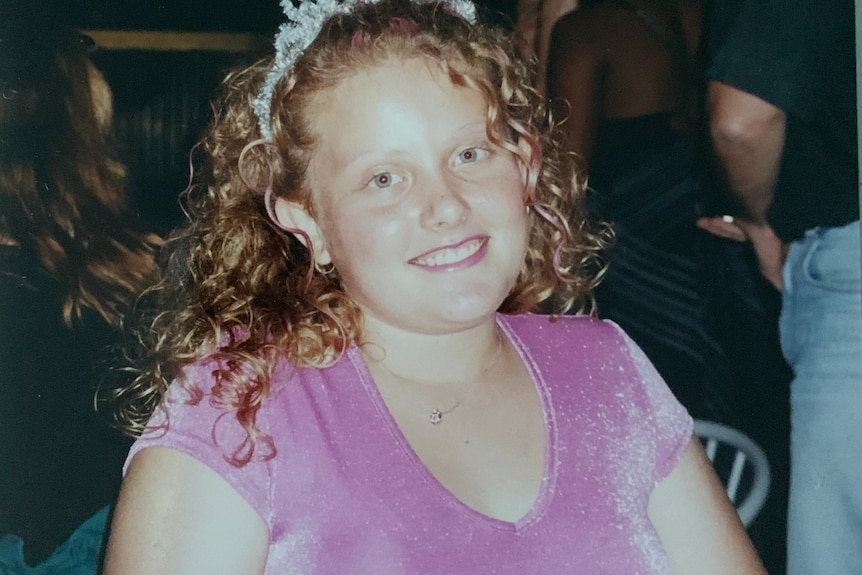 girl in pink top and silver tiara