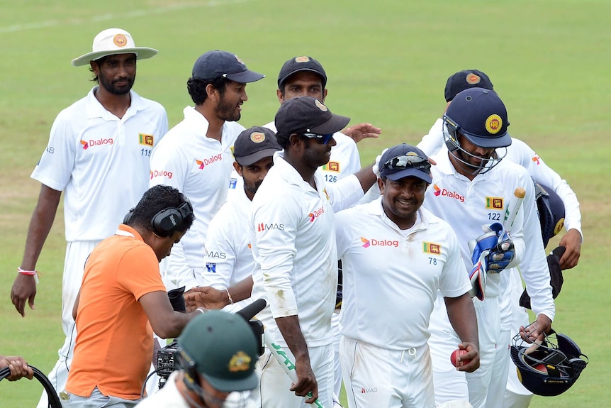 Sri Lanka walks off the field after beating Australia in the first Test