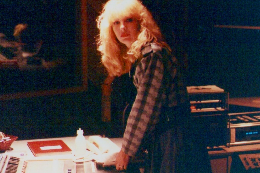 Lori Balmer pictured inside an EMI recording studio at the mixing desk.