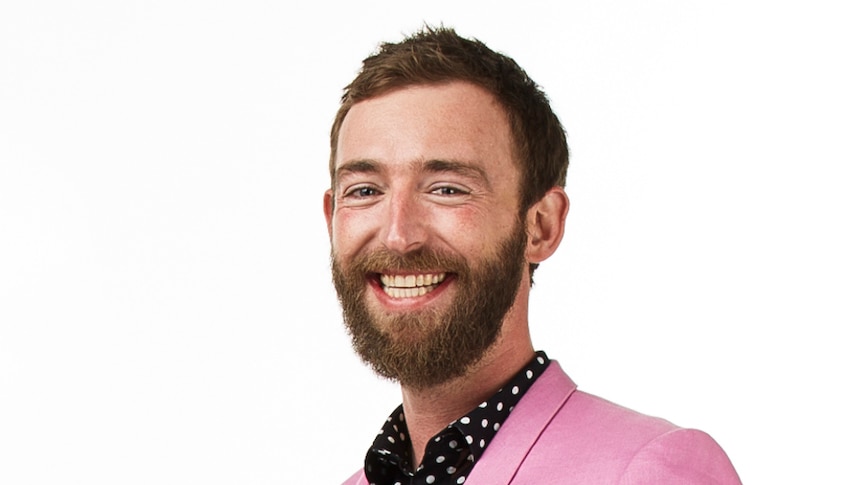 male scientist wearing bright suit