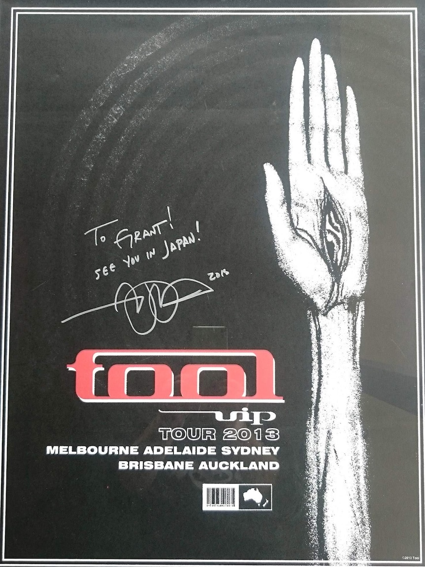 A signed Tool VIP poster
