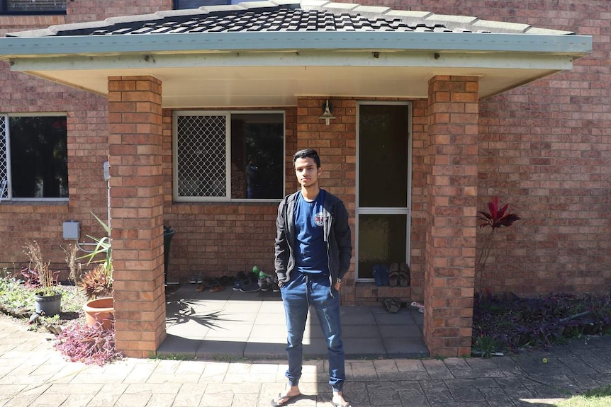 Robi Alam in front of his house in Banyo.