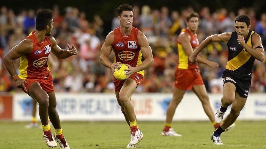 The Suns' Jaeger O'Meara in action in round one, 2014 against Richmond at Carrara.