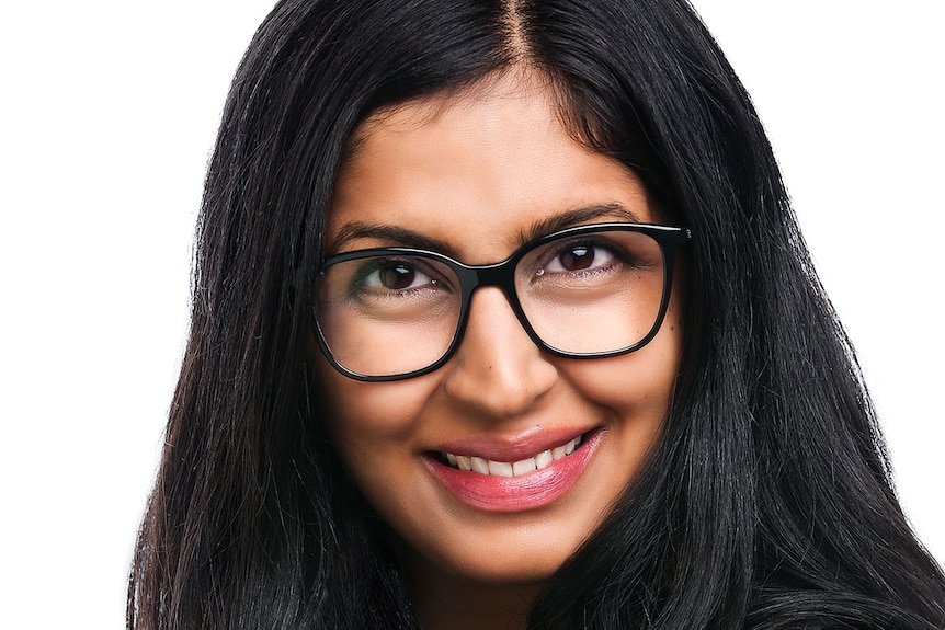 Portrait of a woman with glasses and long black hair.