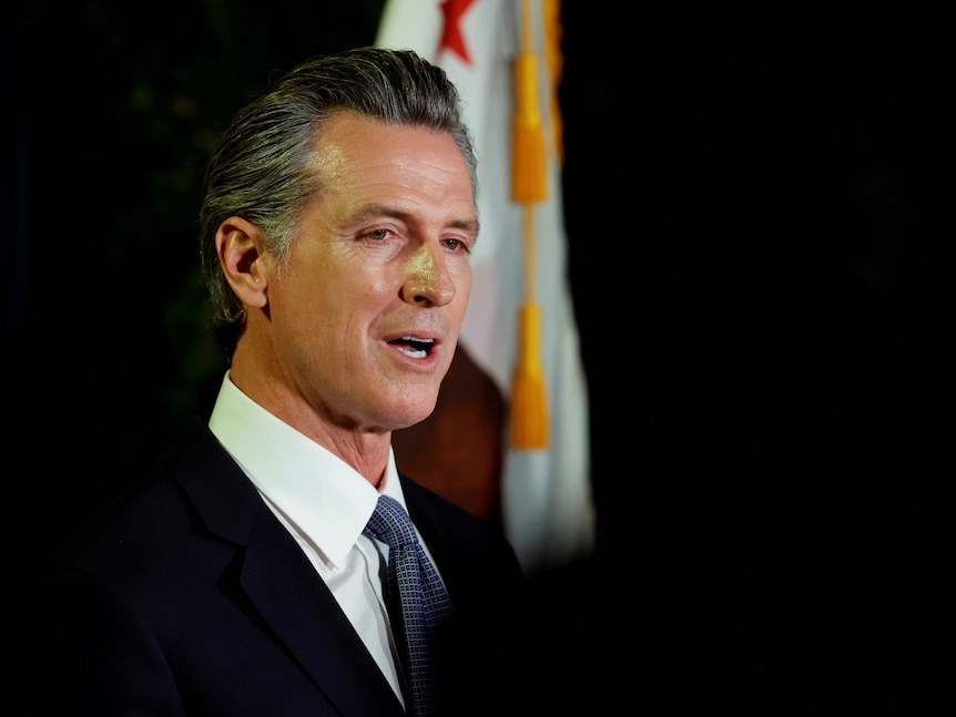 A close-up of Gavin Newsom giving a speech. 