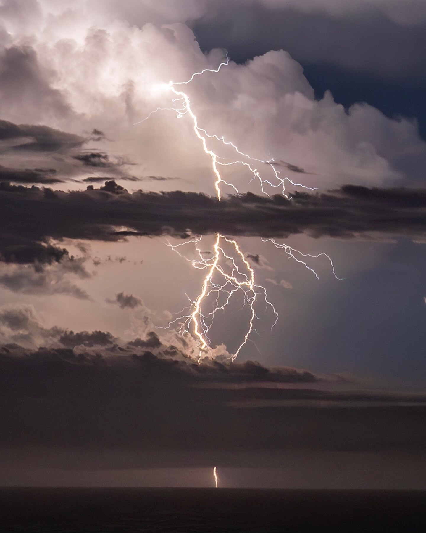 lighting and dark clouds as a storm intensifies over ballina in northern nsw