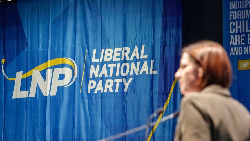 A blue sign reads "Liberal National Party".