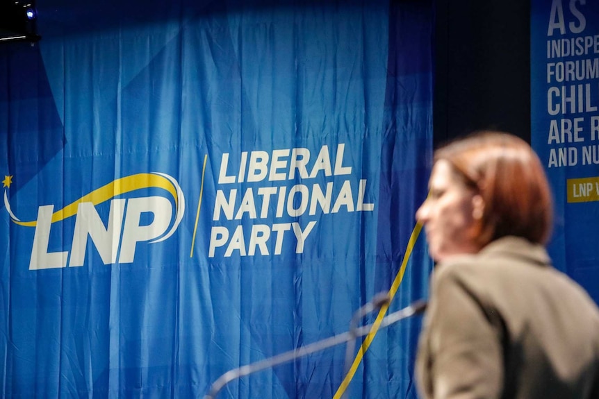 A blue sign reads "Liberal National Party".