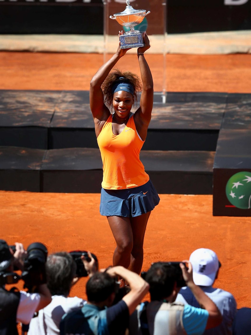 Serena Williams celebrates with the Internazionali BNL d'Italia trophy.