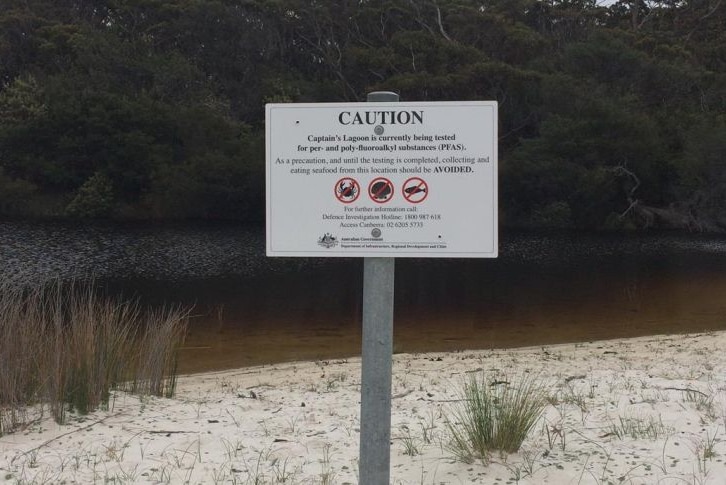 A sign warning people not to eat seafood caught in local waterways