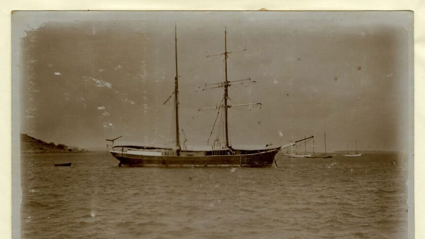 A black and white image of a boat on water