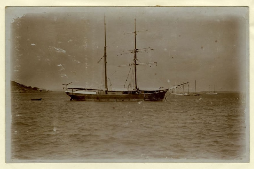 A black and white image of a boat on water