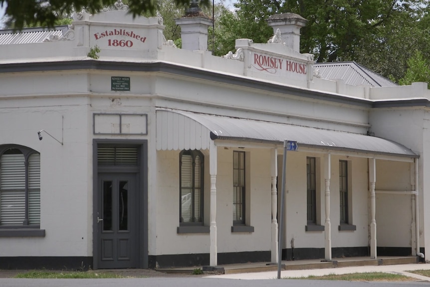 a photo of a white heritage building in country town 