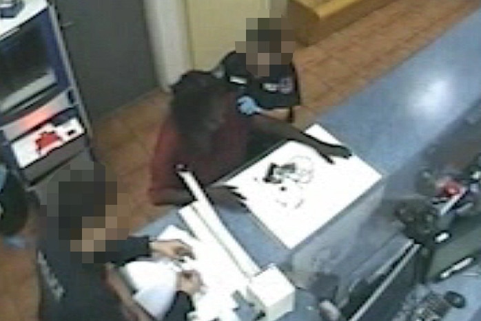 CCTV still of Yvette Bennie being processed at police station after murder of Rosalie Nungarrayi Wayne.