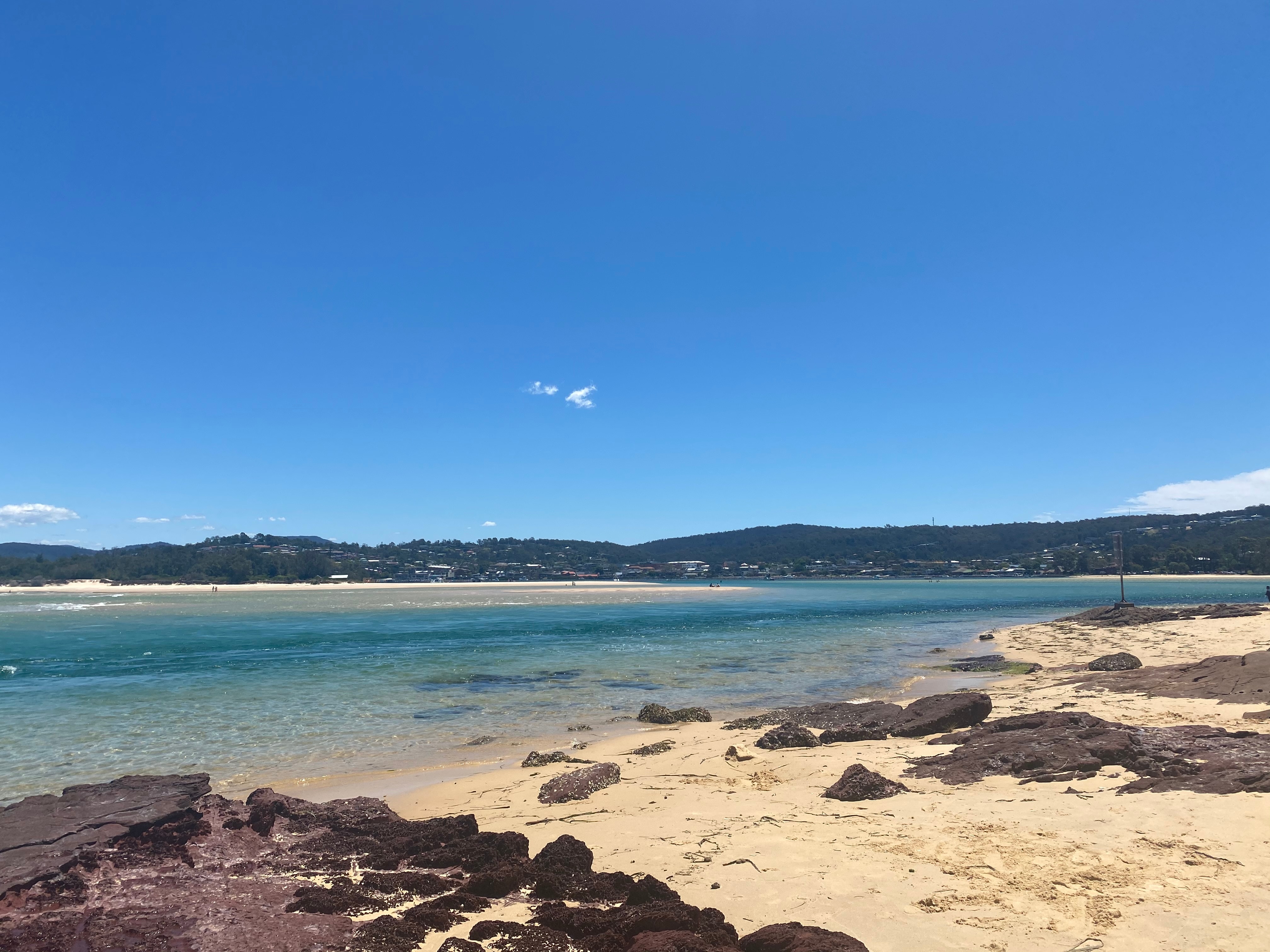A beach and a waterway.