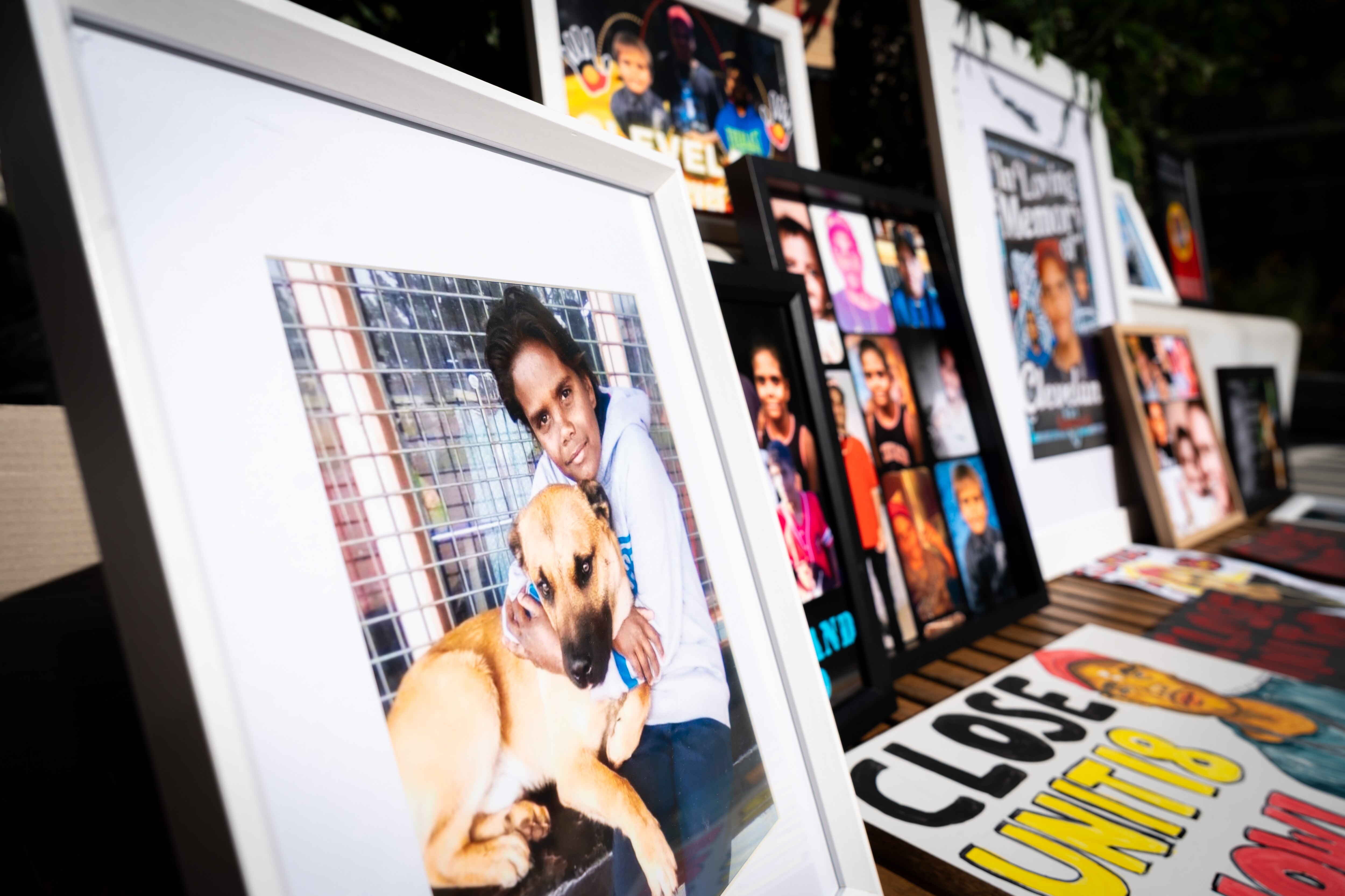 Pictures of Cleveland Dodd stacked outside a building. 