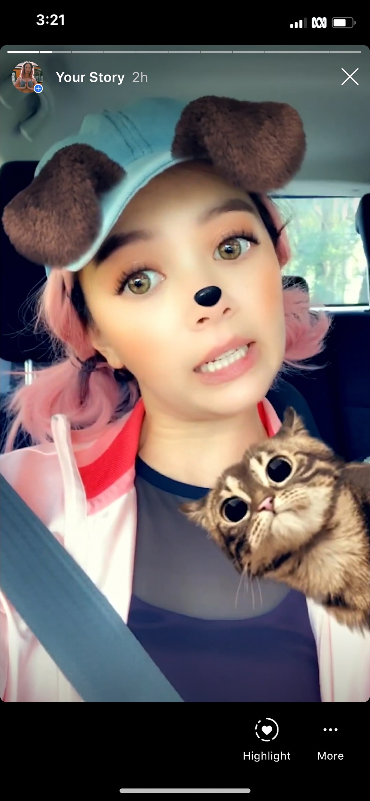 A screenshot of a woman sitting in car and posing in selfie mode with Instagram filters on top of face.