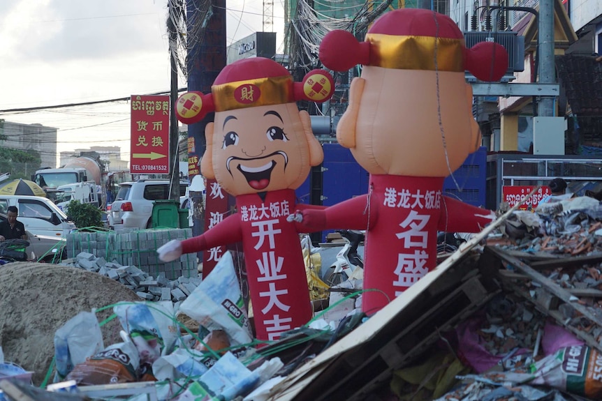 Huge piles of construction rubbish on a busy road