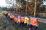 Shirts hang on a fence in protest over the rejection of the Drayton South mine expansion