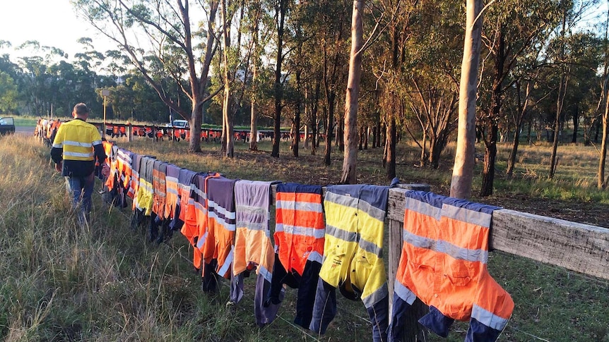 Mineworkers who are likely to lose their jobs at the Drayton mine hang their shirts in protest, after the Drayton South mine expansion is rejected. November 2015.