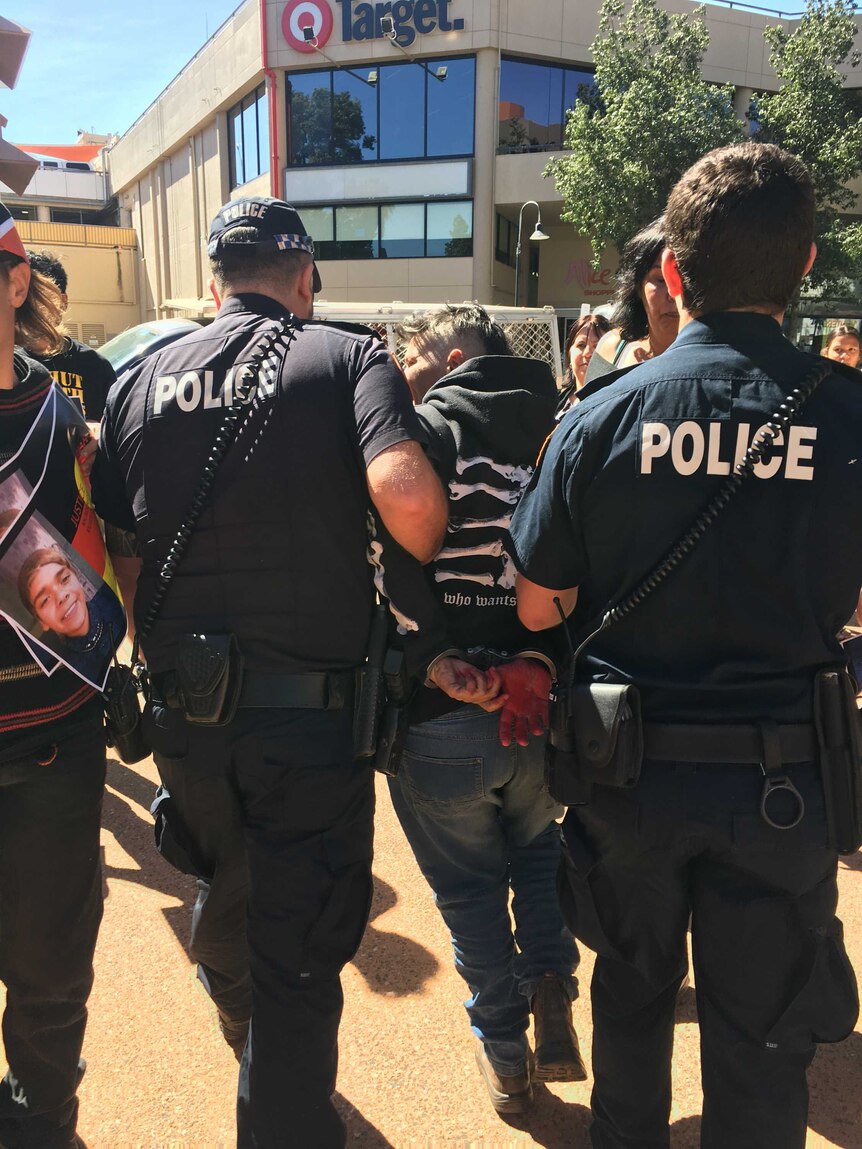 Joanne Voller being arrested by police.