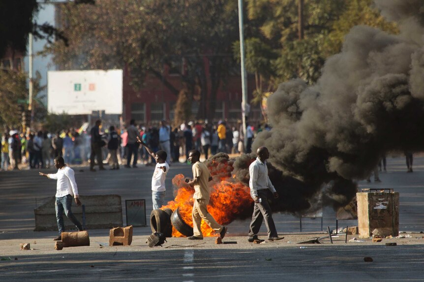 People burn tyres in protest in downtown Harare