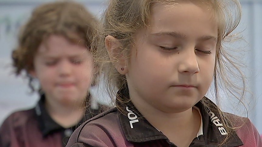 Young students learning to meditate