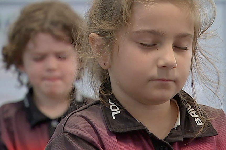 Young students learning to meditate