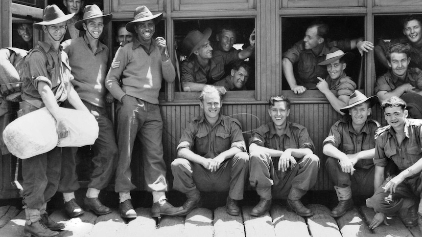 Gunditjmara man Reg Saunders surrounded by his mates of the 2/7th Battalion, in 1943.