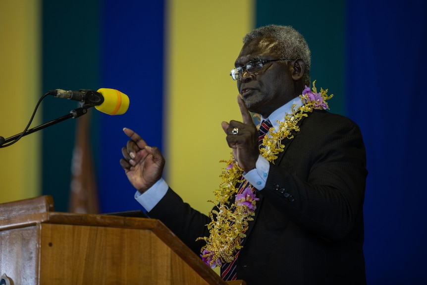 Prime Minister Manasseh Sogavare standing at a podium giving a speech.