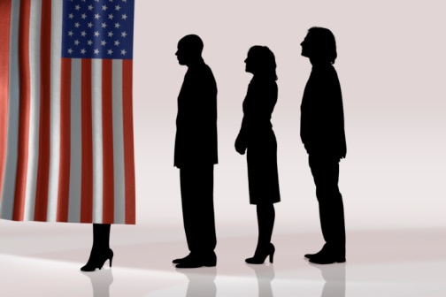 Silhouettes of people in line to vote behind US flag (Thinkstock: Comstock)