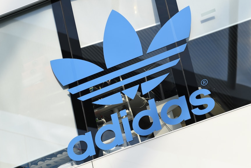 The Adidas logo on a building.