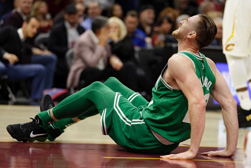 Boston Celtics' Gordon Hayward grimaces in pain as his left ankle is visibly broken.