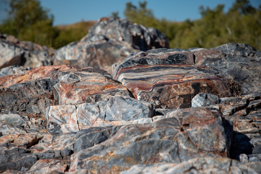 close up on grey and orange streaked rocks