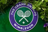 The Wimbledon logo amongst flowers.