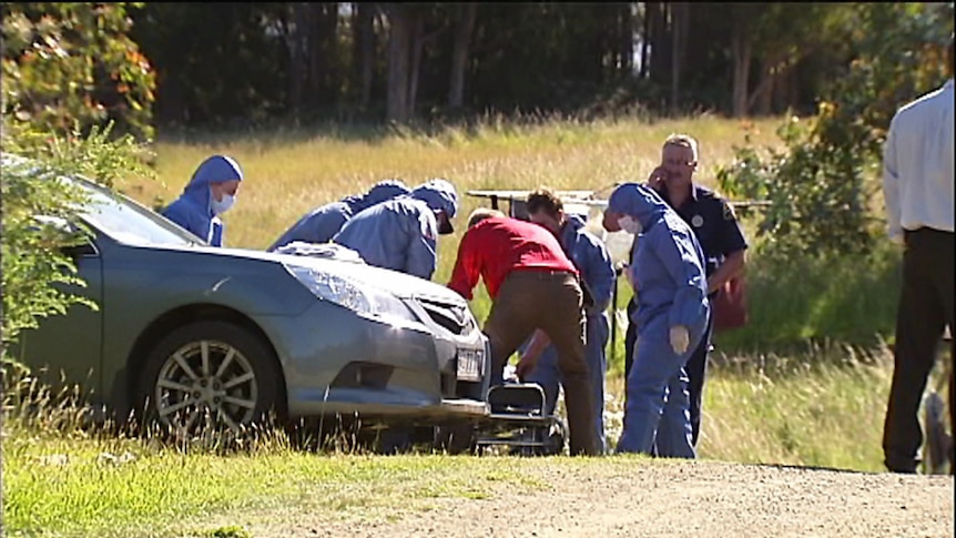 Police remove the body of a man found at Eggs and Bacon Bay in the Huon on December 17, 2011