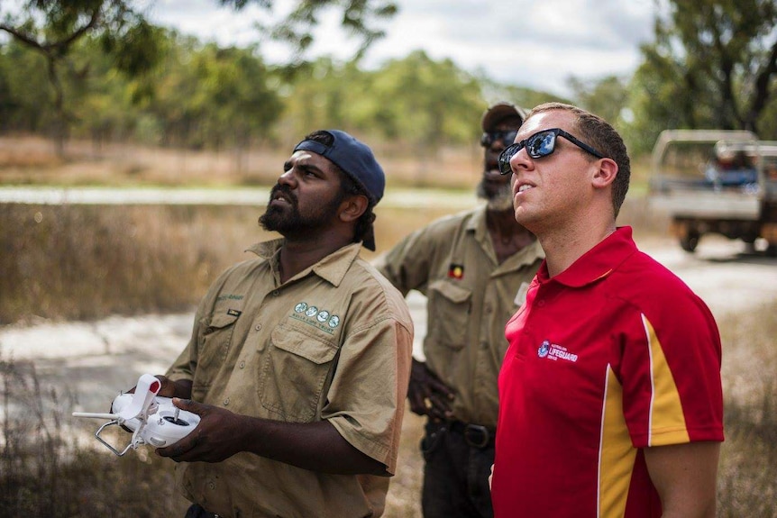 Port Macquarie Lifeguard Supervisor James Turnham helping an indigenous ranger learn how to fly a drone in far north Queensland.