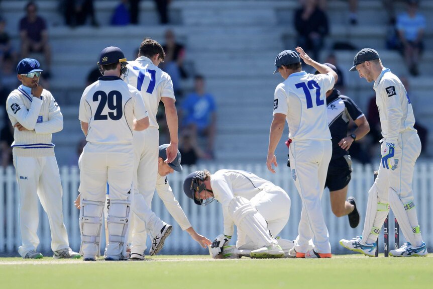 Victoria's Will Pucovski is taken off injured after getting hit by a ball against NSW in March 2018.