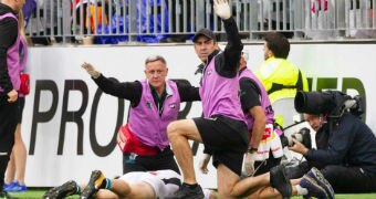 Robbie Gray lies flat on the field as referees and medical aids signal for help