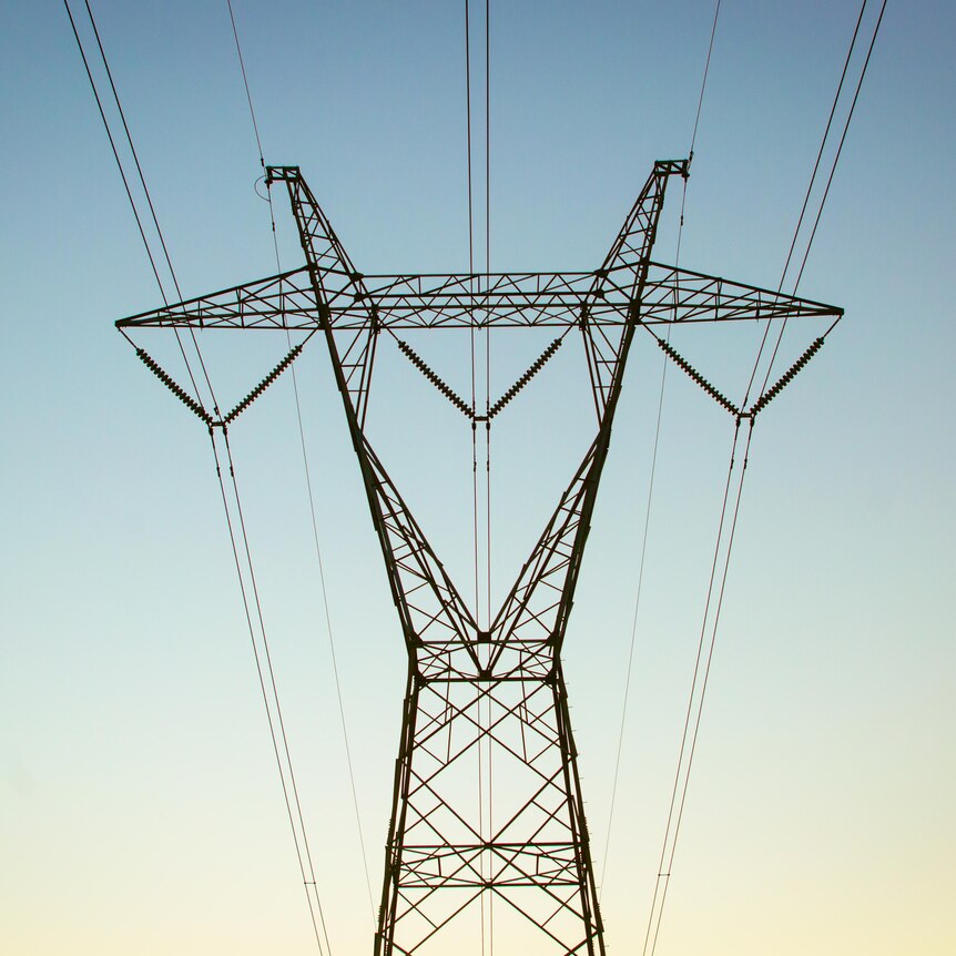 Powerlines across a blue sky.
