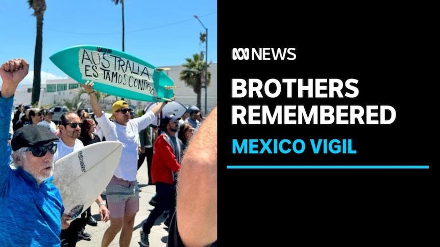Brothers Rememberd, Mexico Vigil: A crowd of people, some holding surfboards, march down a road.