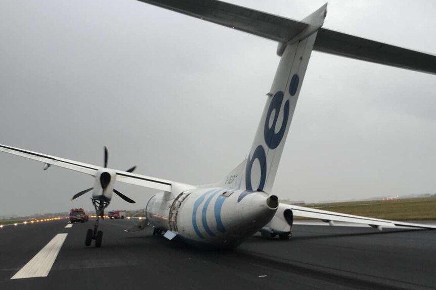 Plane lands on its side after landing gear fails