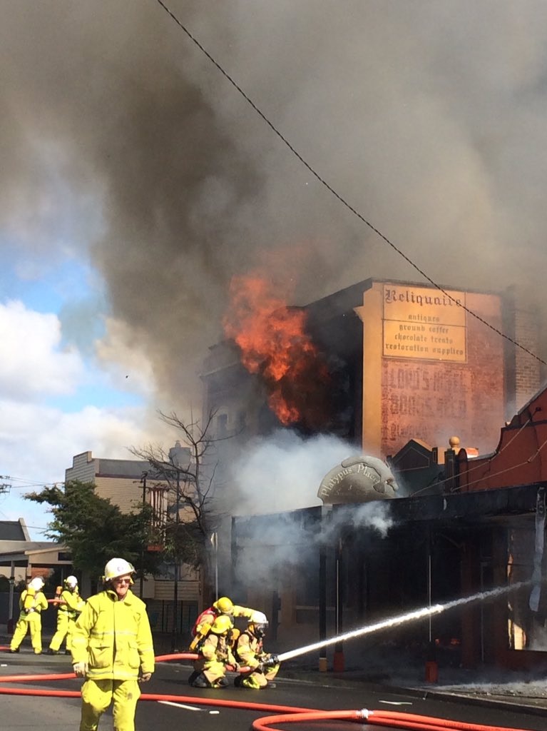 Frirefighters battle fire burning in Reliquaire doll shop