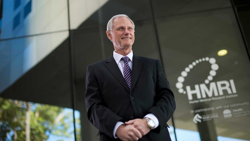 Professor Nicholas Talley stands outside a building.