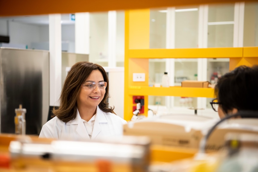 Woman wearing white lab coat in a laboratory. 